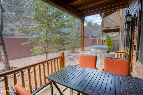 a view of a backyard with sitting area