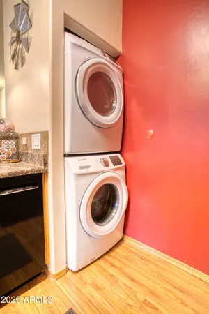 a view of a dining room with furniture and a window