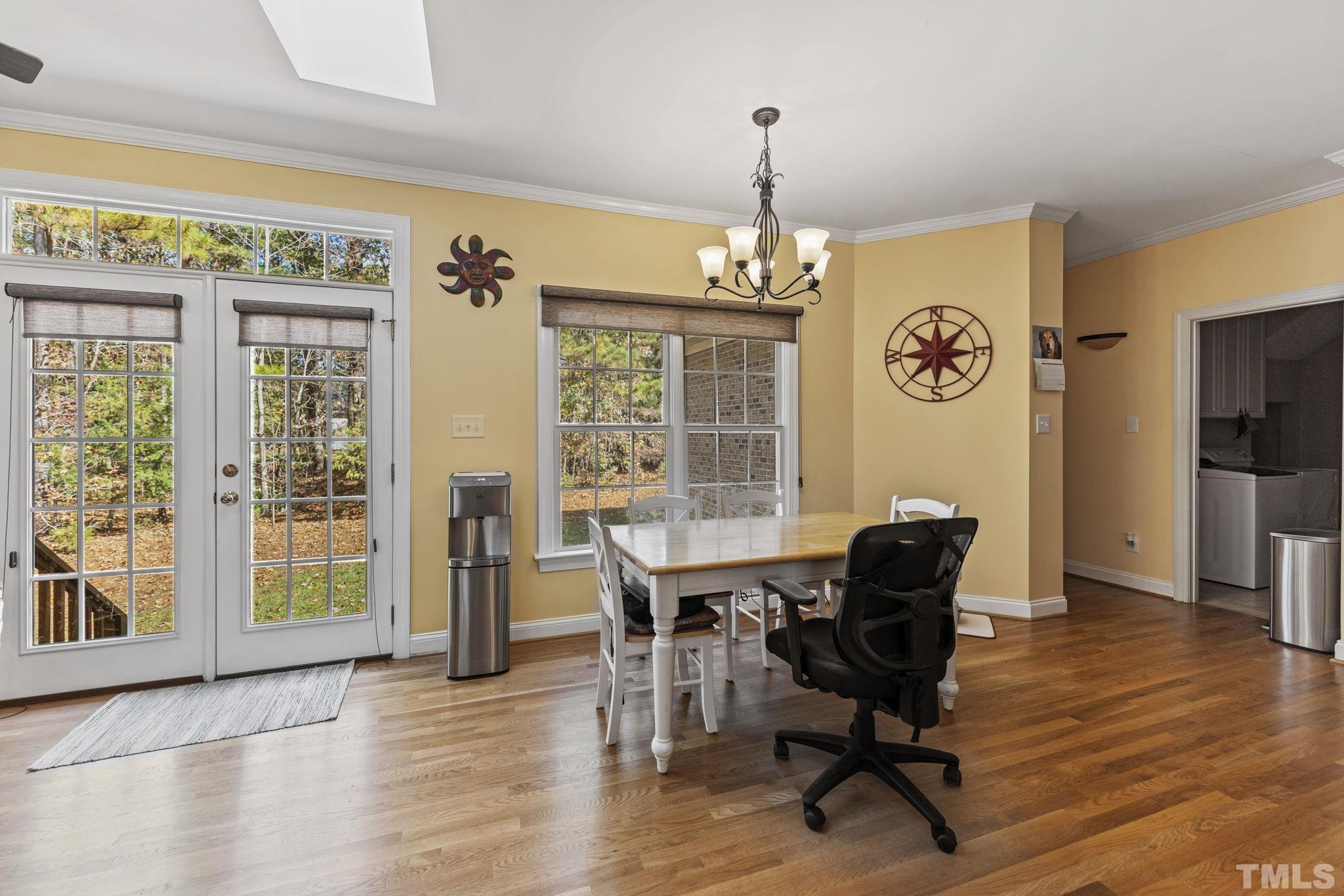25 Eaglefeather Path Youngsville, NC 27596 - Photo 12 of 36 a view of a dining room with furniture window and wooden floor