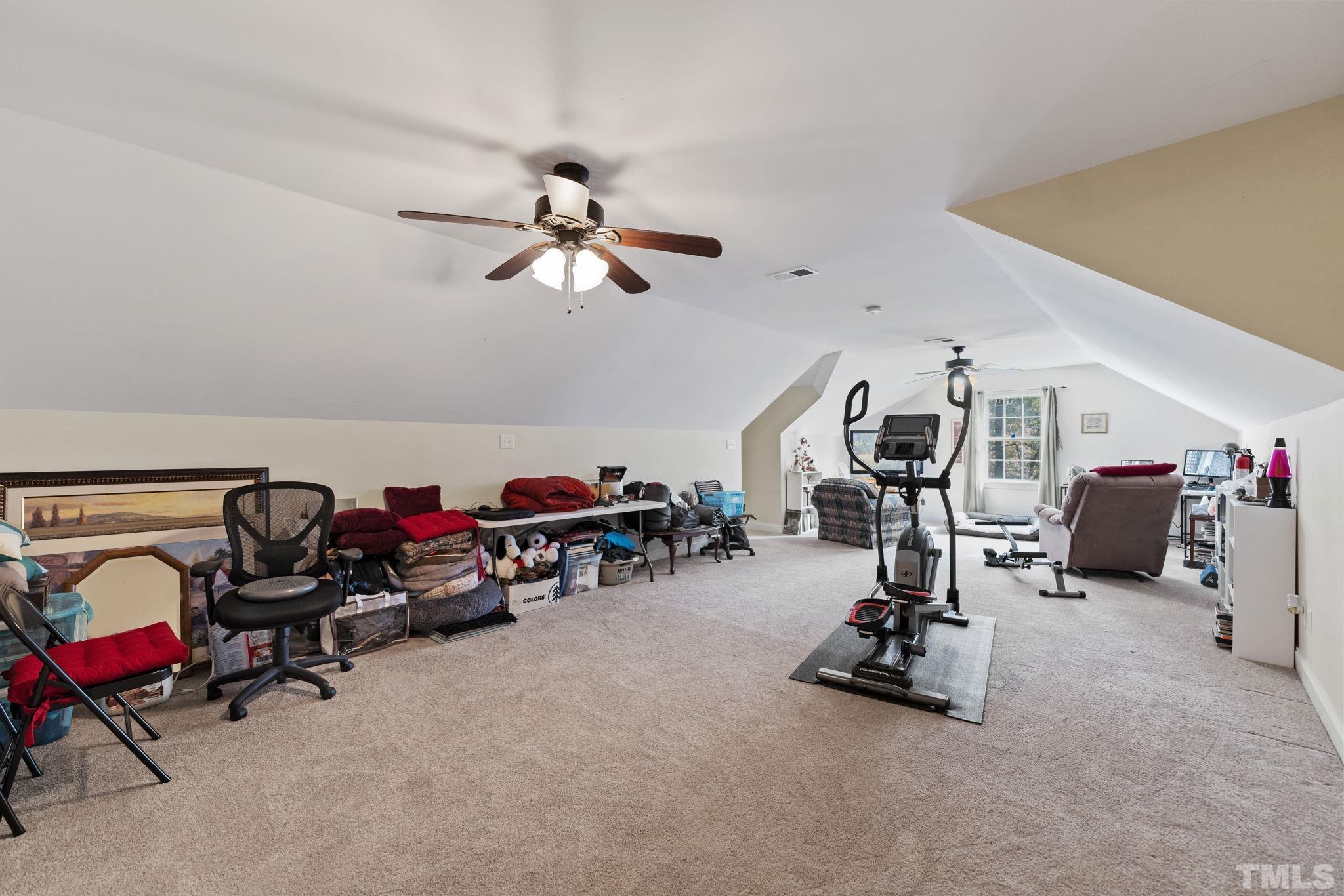 25 Eaglefeather Path Youngsville, NC 27596 - Photo 27 of 36 a view of a room with gym equipment