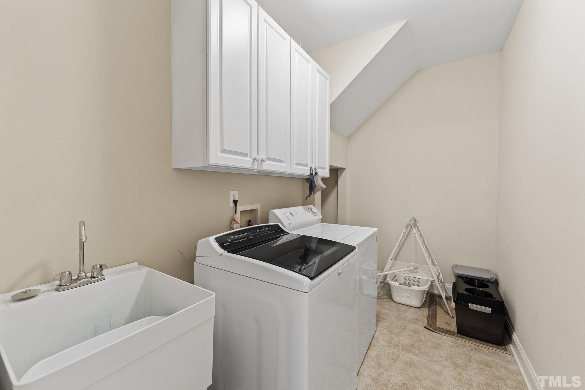 25 Eaglefeather Path Youngsville, NC 27596 - Photo 29 of 36 a bathroom with a sink and a stove top oven