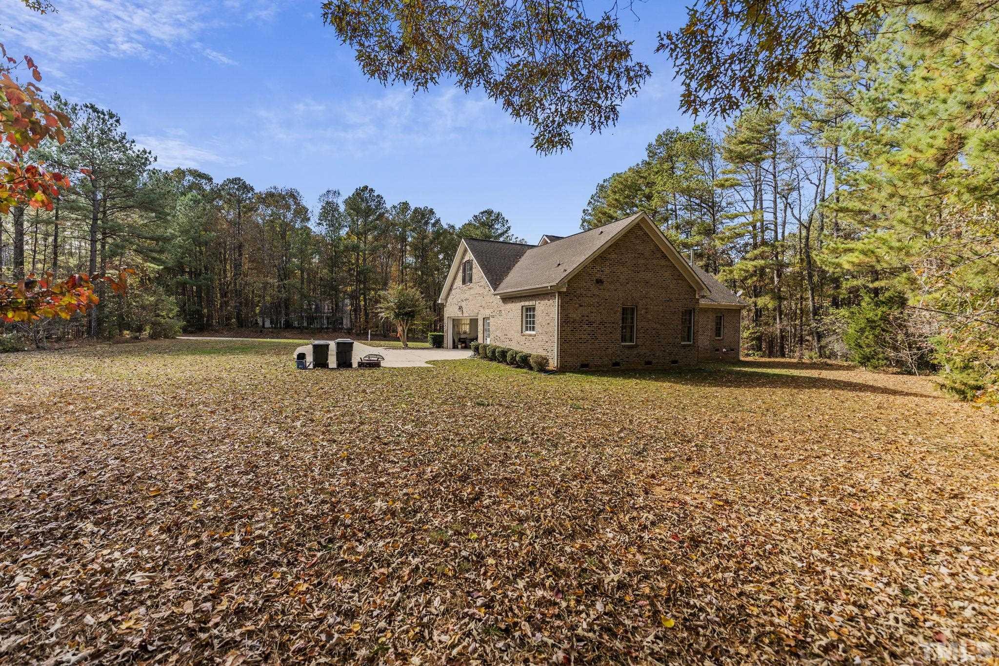 25 Eaglefeather Path Youngsville, NC 27596 - Photo 31 of 36 a house with trees in the background