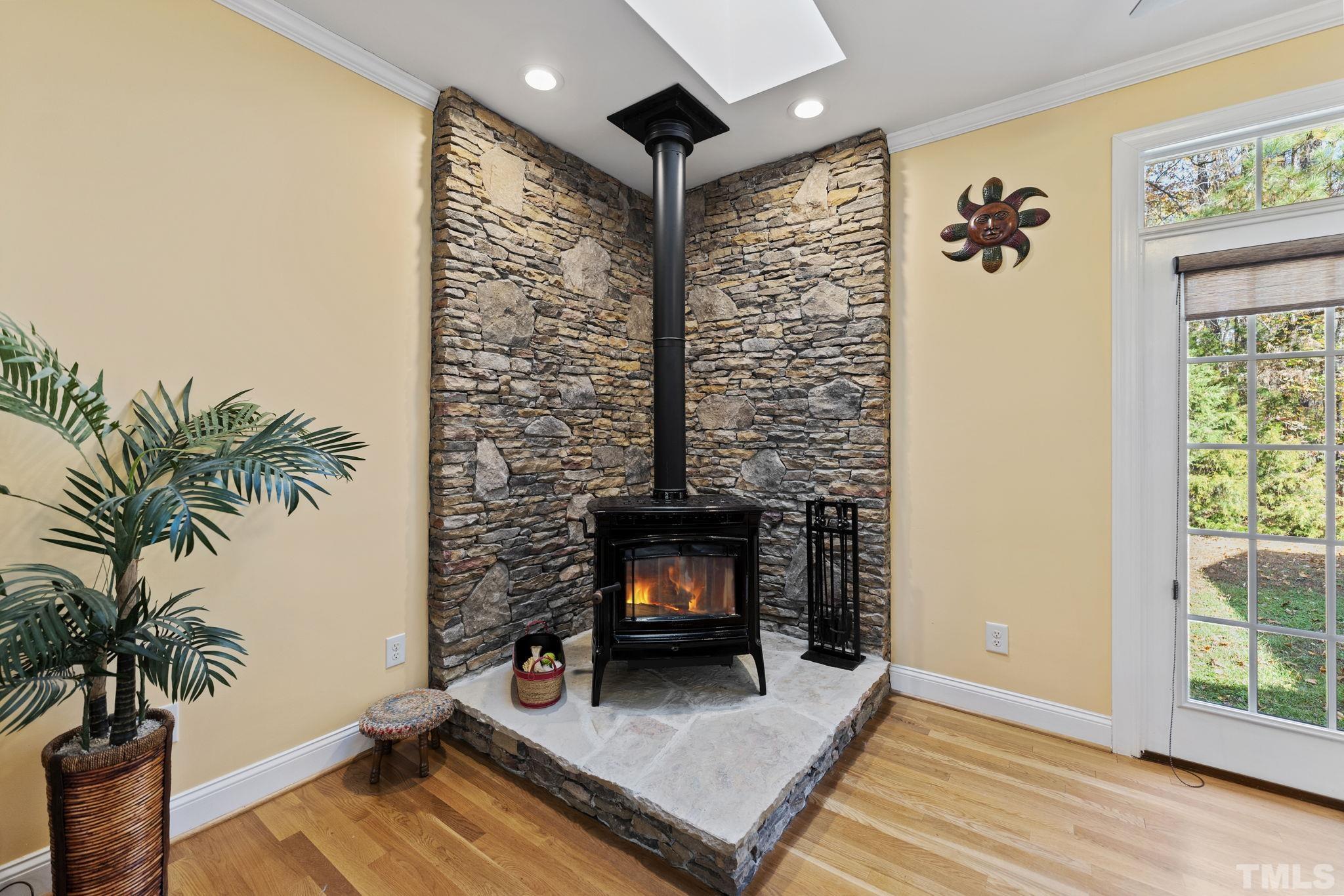 25 Eaglefeather Path Youngsville, NC 27596 - Photo 8 of 36 a living room with furniture and a fireplace