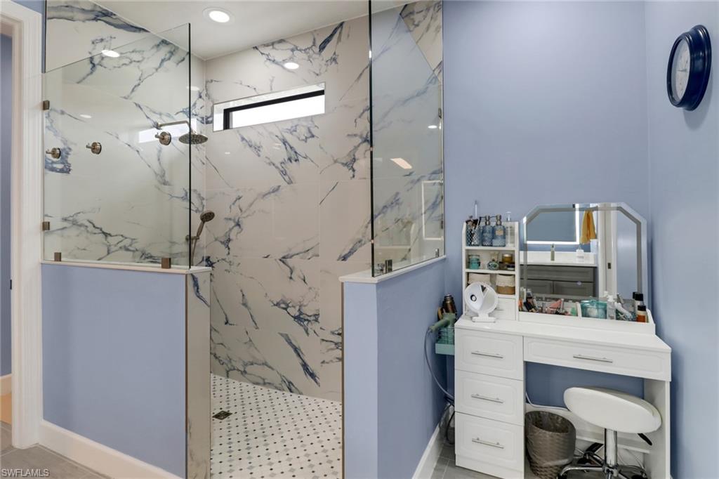 14236 Moonlit Way Estero, FL 33928 - Photo 16 of 46 a bathroom with a sink and mirror