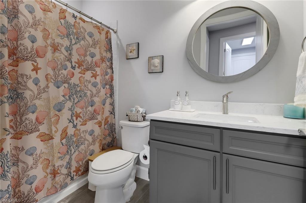 14236 Moonlit Way Estero, FL 33928 - Photo 23 of 46 a bathroom with a sink and a mirror