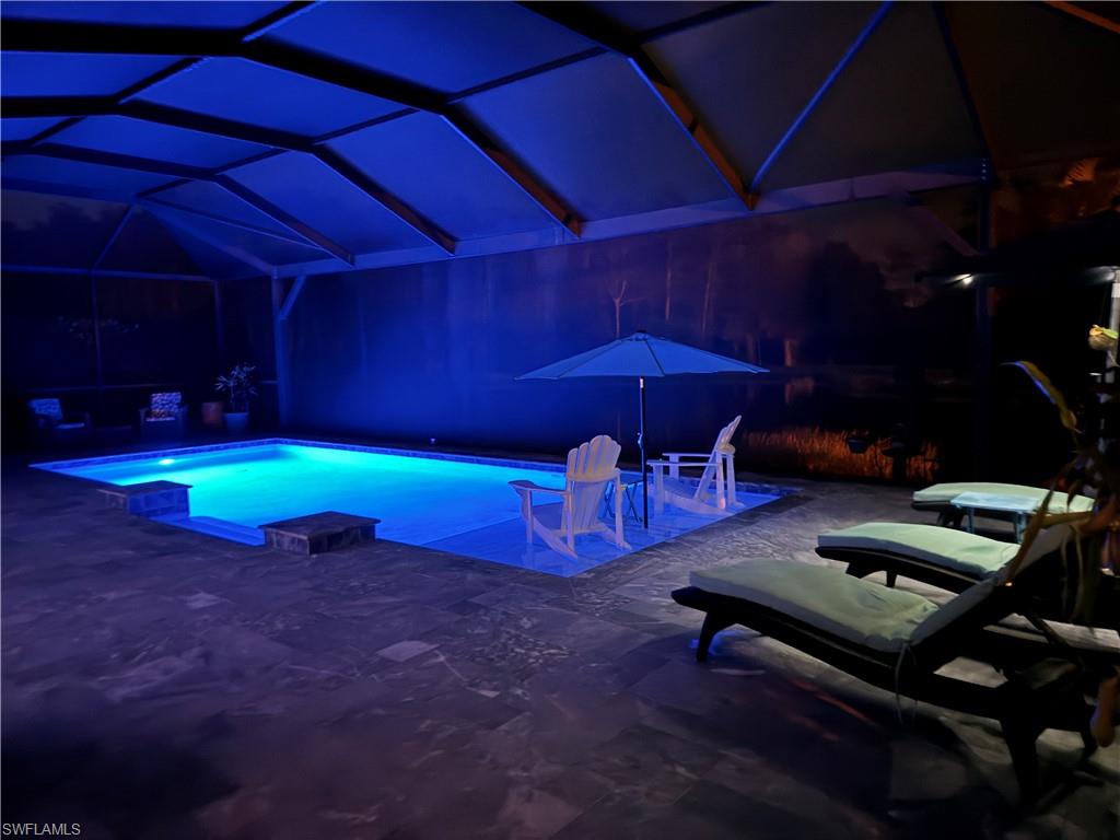 14236 Moonlit Way Estero, FL 33928 - Photo 31 of 46 a backyard of a house with outdoor seating