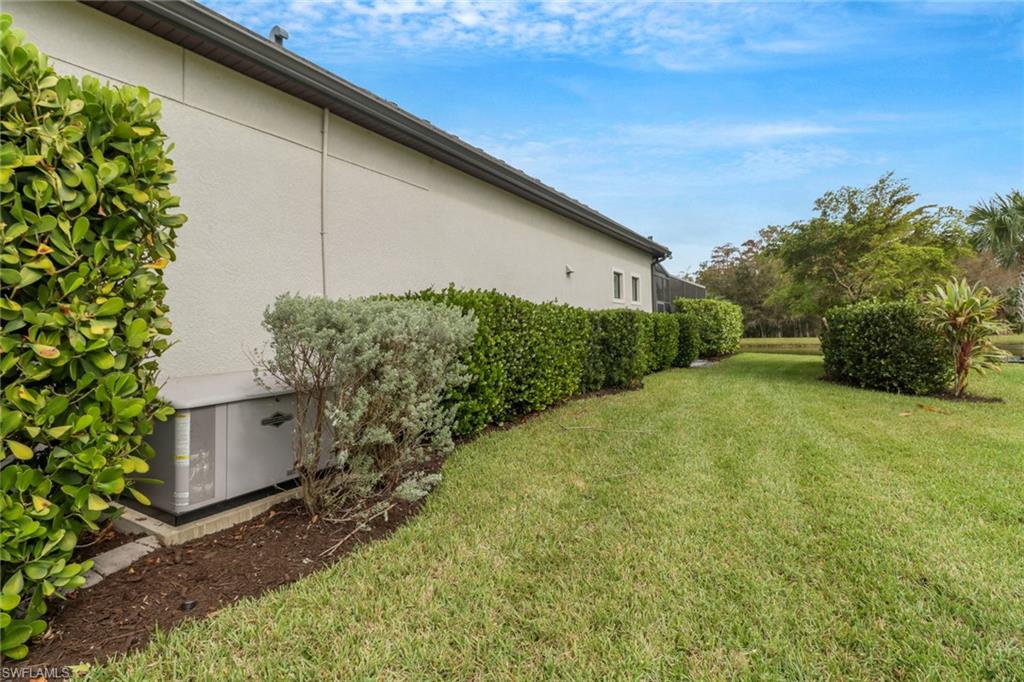 14236 Moonlit Way Estero, FL 33928 - Photo 32 of 46 a backyard of a house with lots of green space