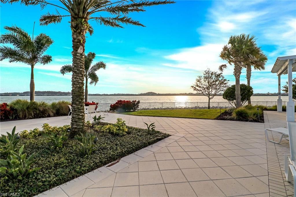 14236 Moonlit Way Estero, FL 33928 - Photo 45 of 46 a view of a lake with a big yard