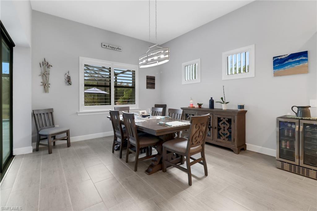 14236 Moonlit Way Estero, FL 33928 - Photo 10 of 46 a view of a dining room with furniture and window