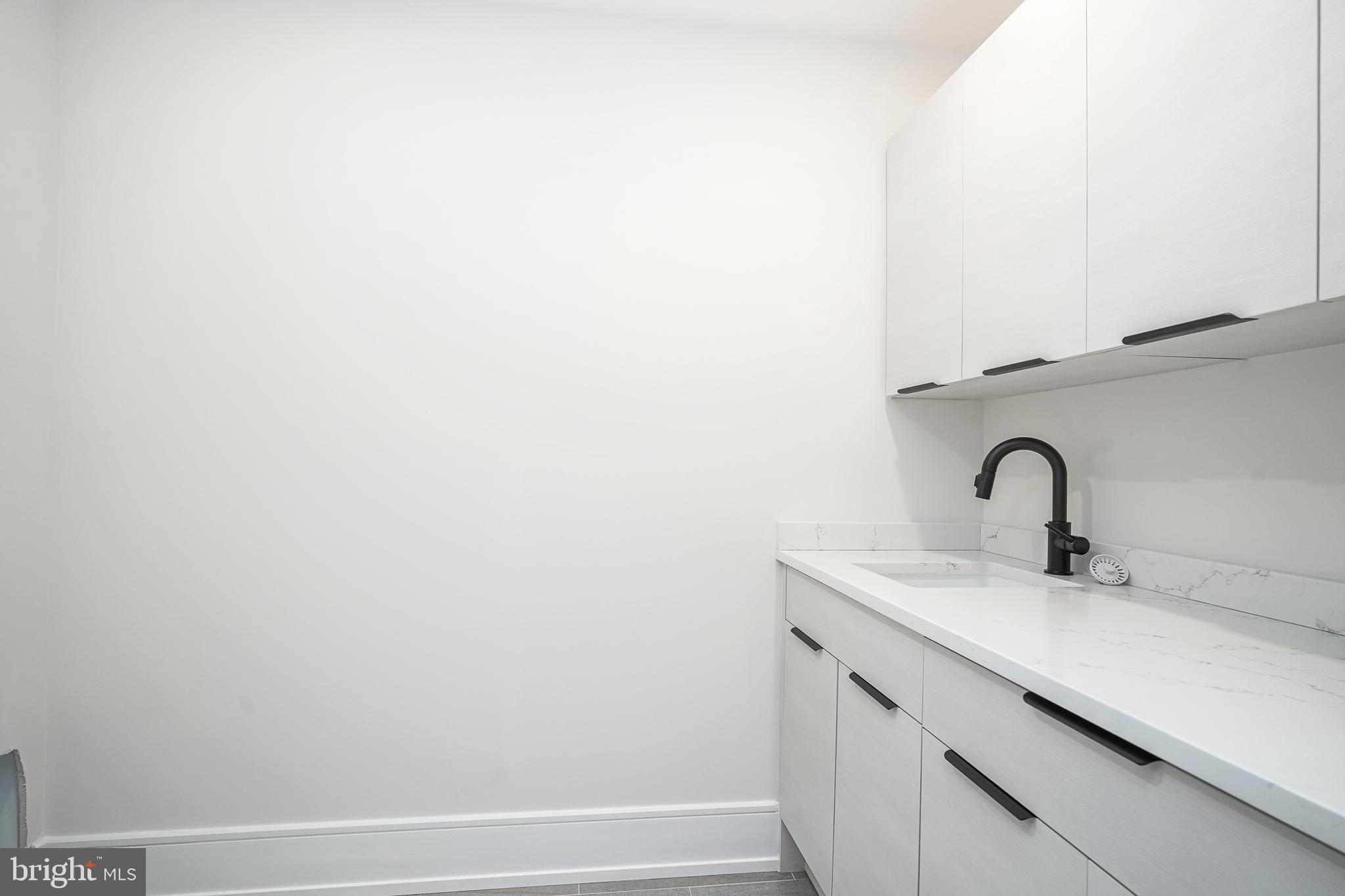 2002 Renaissance Walk, Unit 2 Philadelphia, PA 19145 - Photo 39 of 66 Large Laundry room - plenty of storage & sink