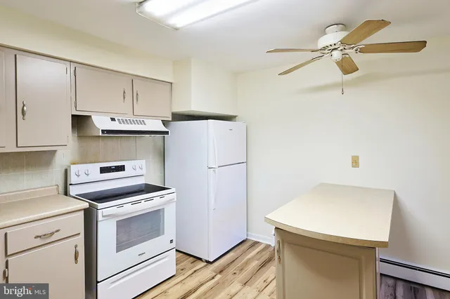 a bathroom with a sink mirror and vanity