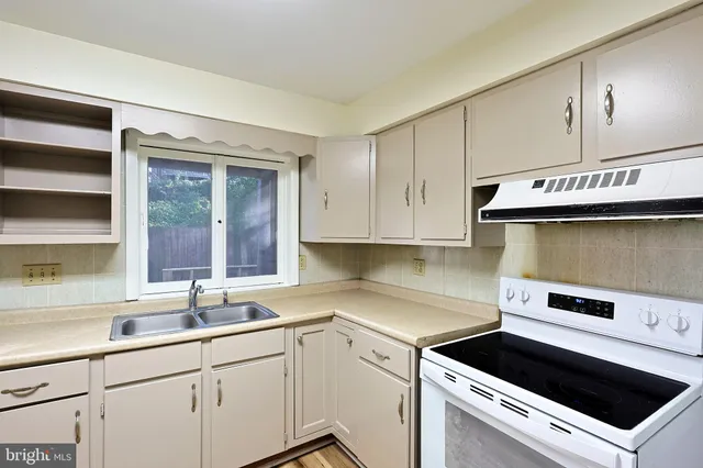 a bathroom with a sink mirror and toilet