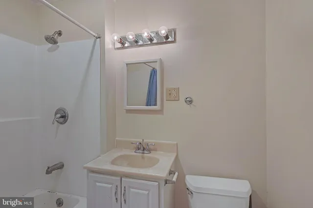 a view of a livingroom with wooden floor and cabinet