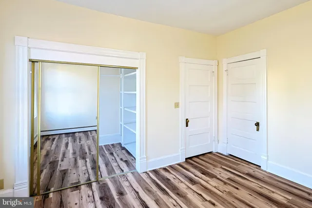 a view of front door with wooden floor