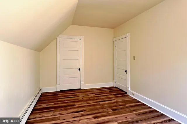 a view of a brick house with many windows