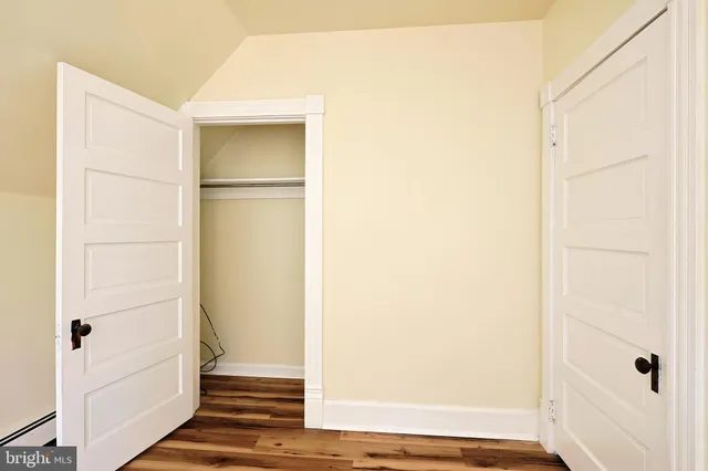 a balcony with table and chairs