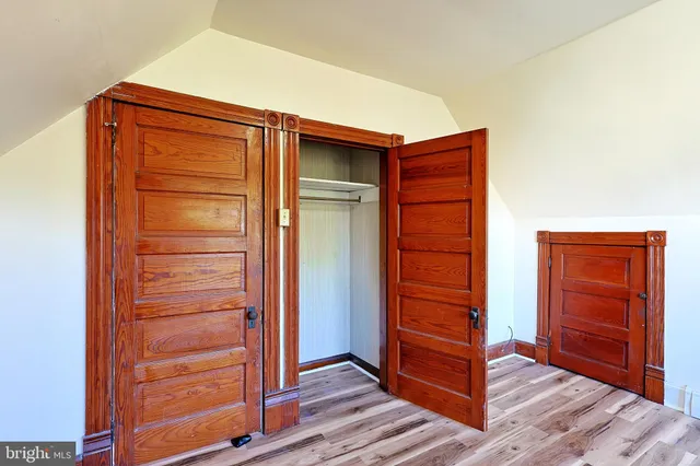 a view of a wooden door of the house