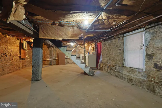 an aerial view of a house with a yard and lake view