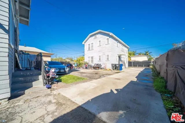 a view of a backyard with sitting area
