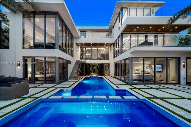 a view of building with a swimming pool