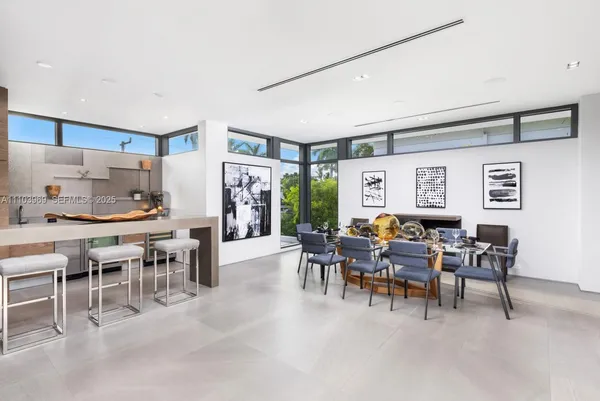 a kitchen with a sink and white cabinets