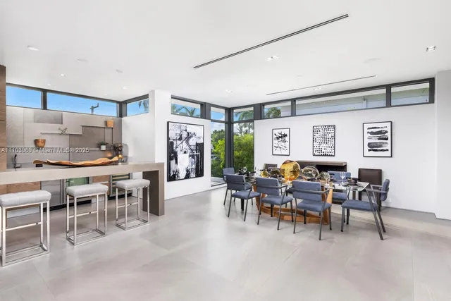 a large white kitchen with a large window