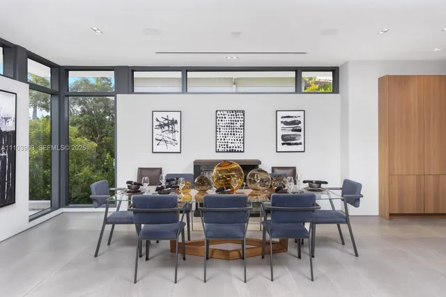 a kitchen with stainless steel appliances kitchen island a large island in the center