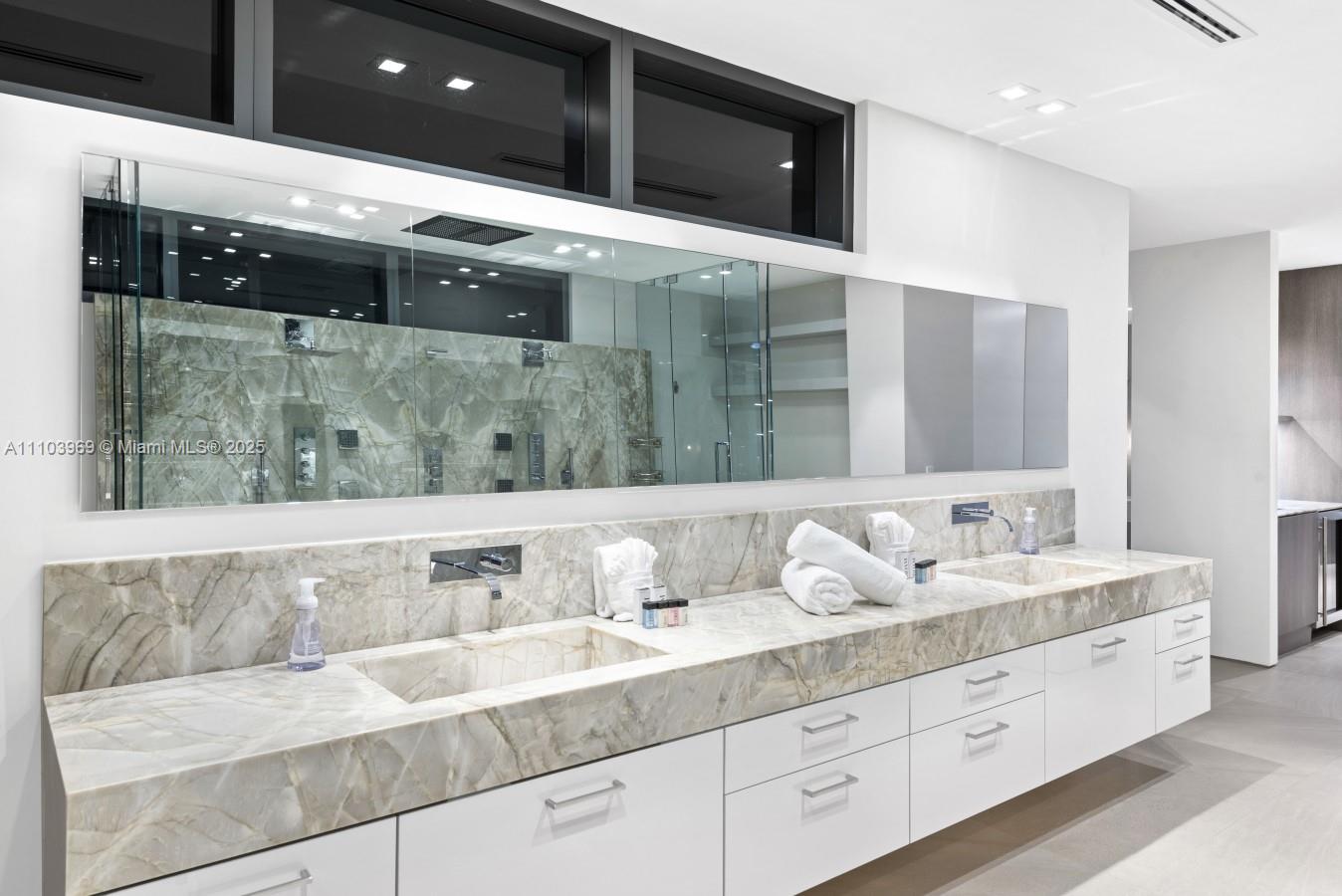 440 Mola Avenue Fort Lauderdale, FL 33301 - Photo 23 of 66 a bathroom with a sink and a mirror