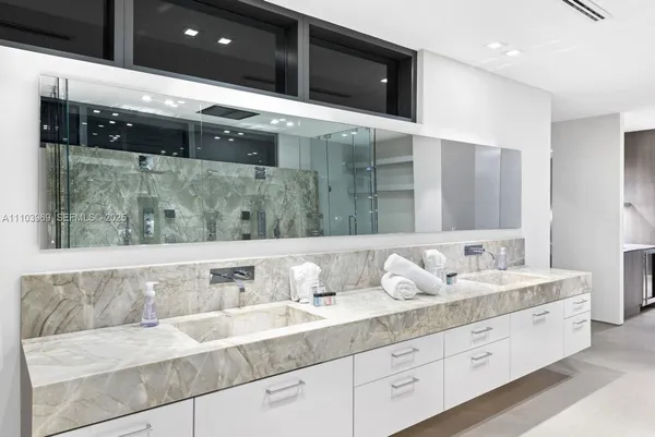 a room with lots of potted plants and wooden floor