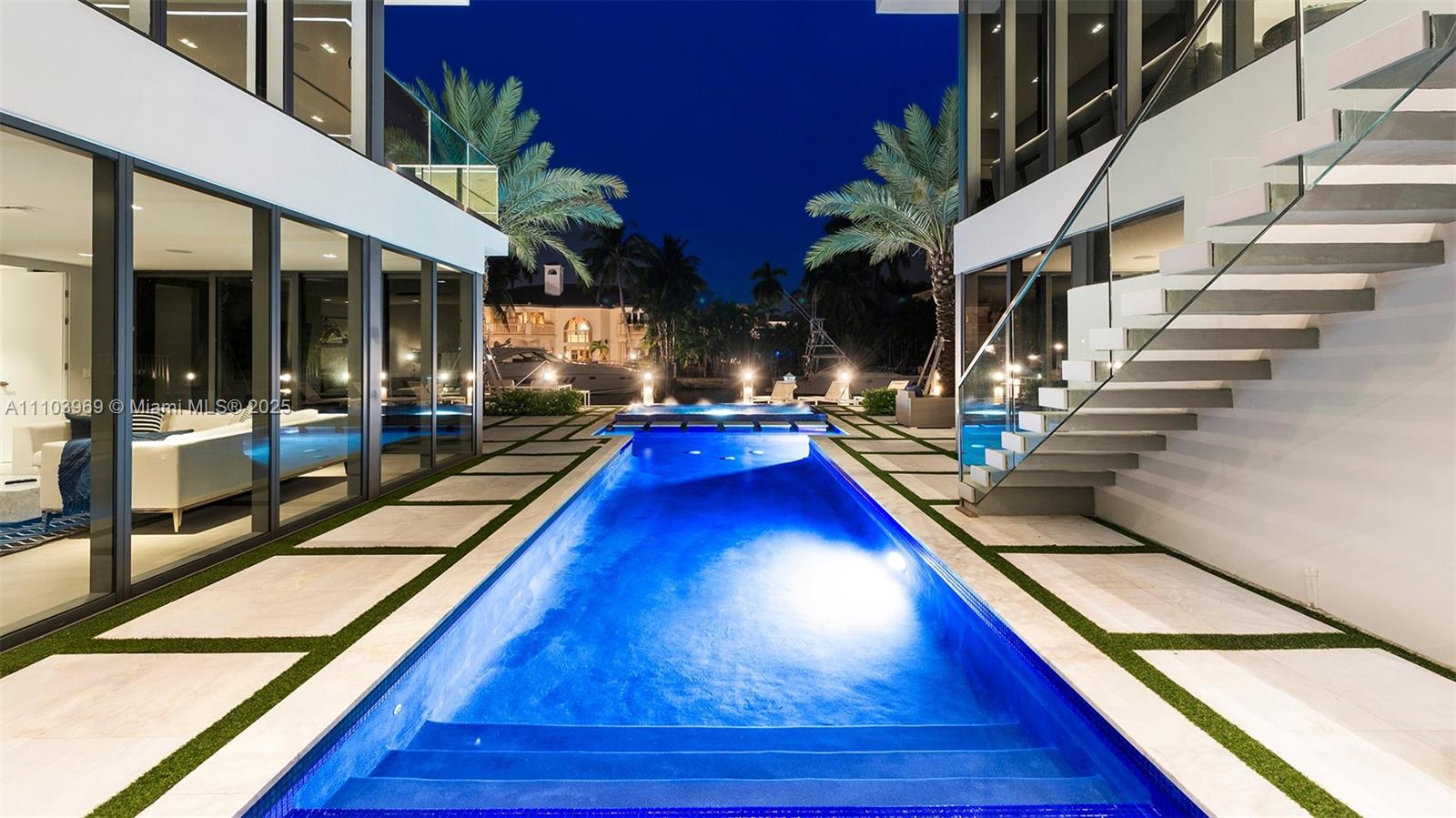 440 Mola Avenue Fort Lauderdale, FL 33301 - Photo 30 of 66 a room with lots of potted plants and wooden floor