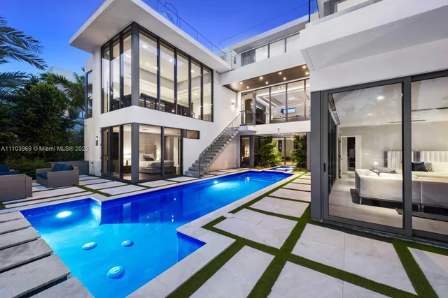 a view of a patio with chairs and a table