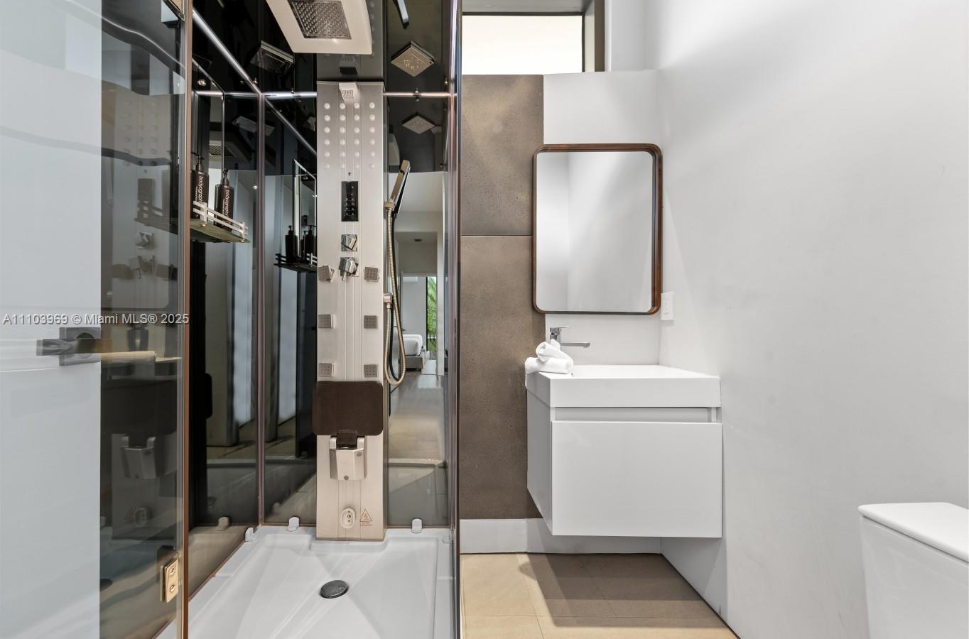 440 Mola Avenue Fort Lauderdale, FL 33301 - Photo 42 of 66 a bathroom with a sink toilet and shower