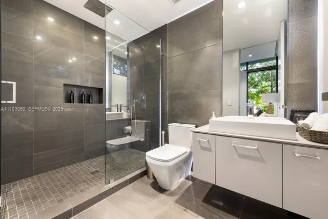 a bedroom with a large bed and a large window