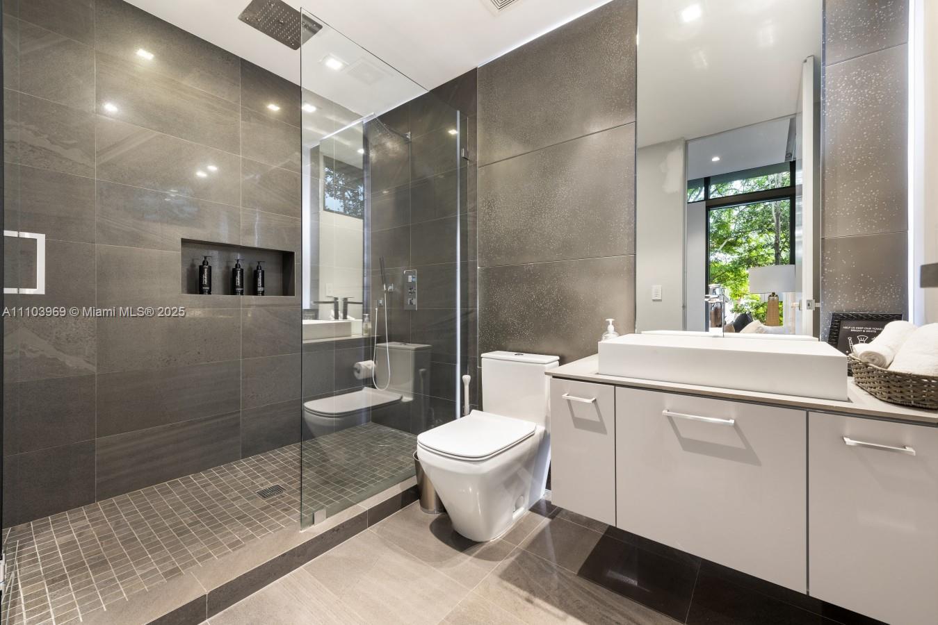 440 Mola Avenue Fort Lauderdale, FL 33301 - Photo 44 of 66 a bathroom with a toilet sink and mirror