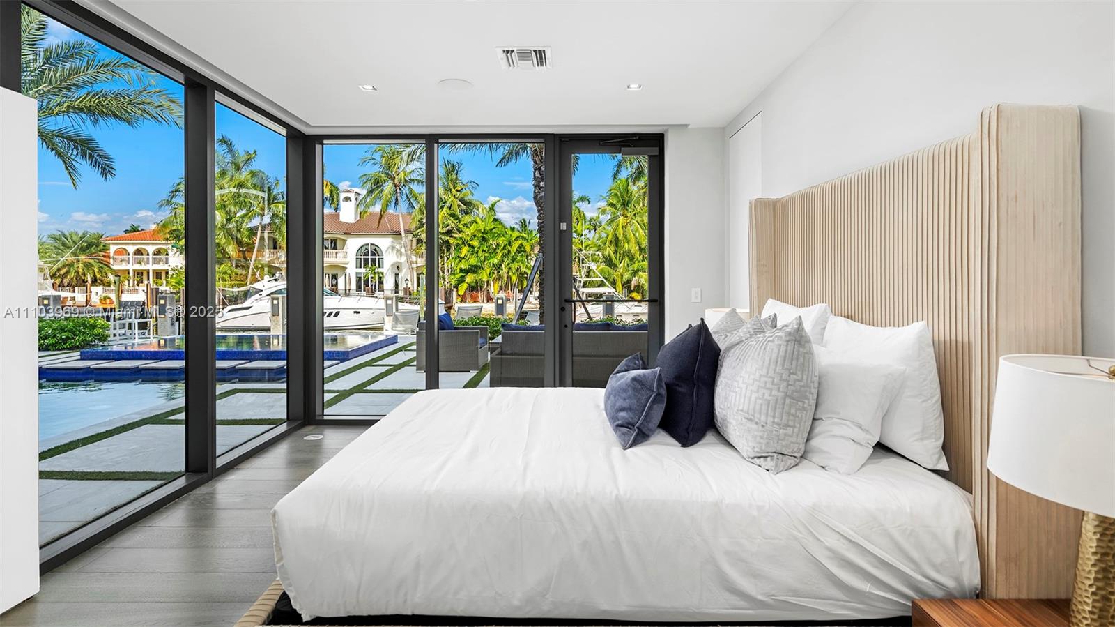 440 Mola Avenue Fort Lauderdale, FL 33301 - Photo 46 of 66 a large bedroom with a large bed and a large window