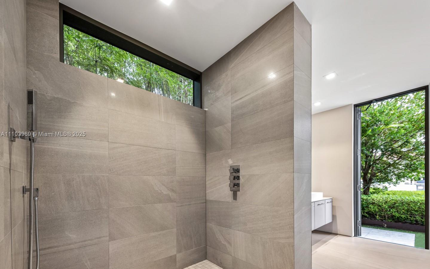 440 Mola Avenue Fort Lauderdale, FL 33301 - Photo 47 of 66 a bathroom with a shower and a toilet