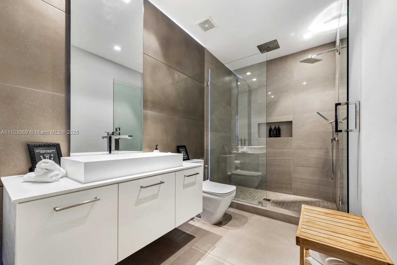 440 Mola Avenue Fort Lauderdale, FL 33301 - Photo 48 of 66 a bathroom with a double vanity sink toilet and shower