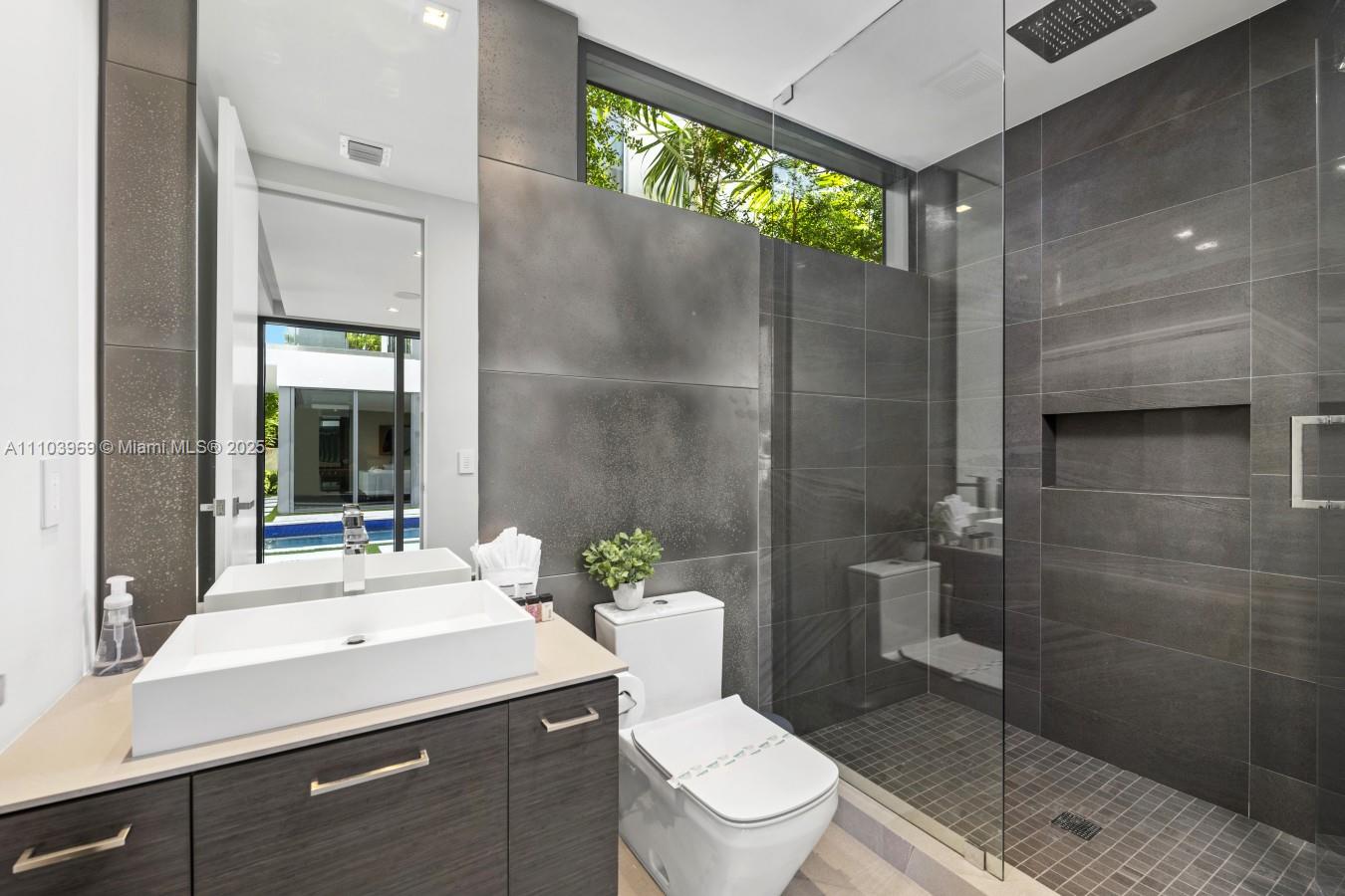 440 Mola Avenue Fort Lauderdale, FL 33301 - Photo 52 of 66 a bathroom with a sink a toilet and shower