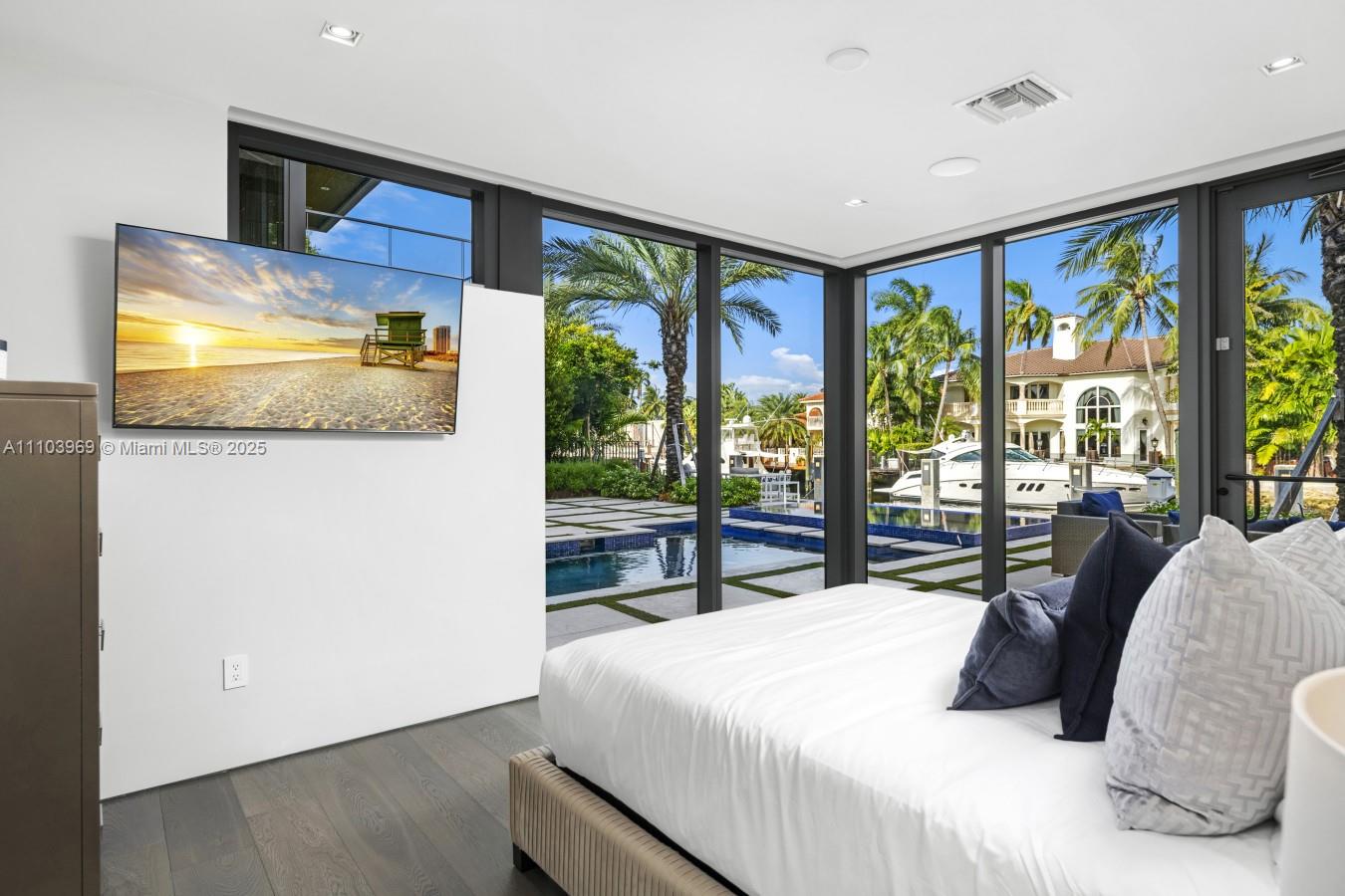 440 Mola Avenue Fort Lauderdale, FL 33301 - Photo 53 of 66 a bedroom with a large bed and a large window