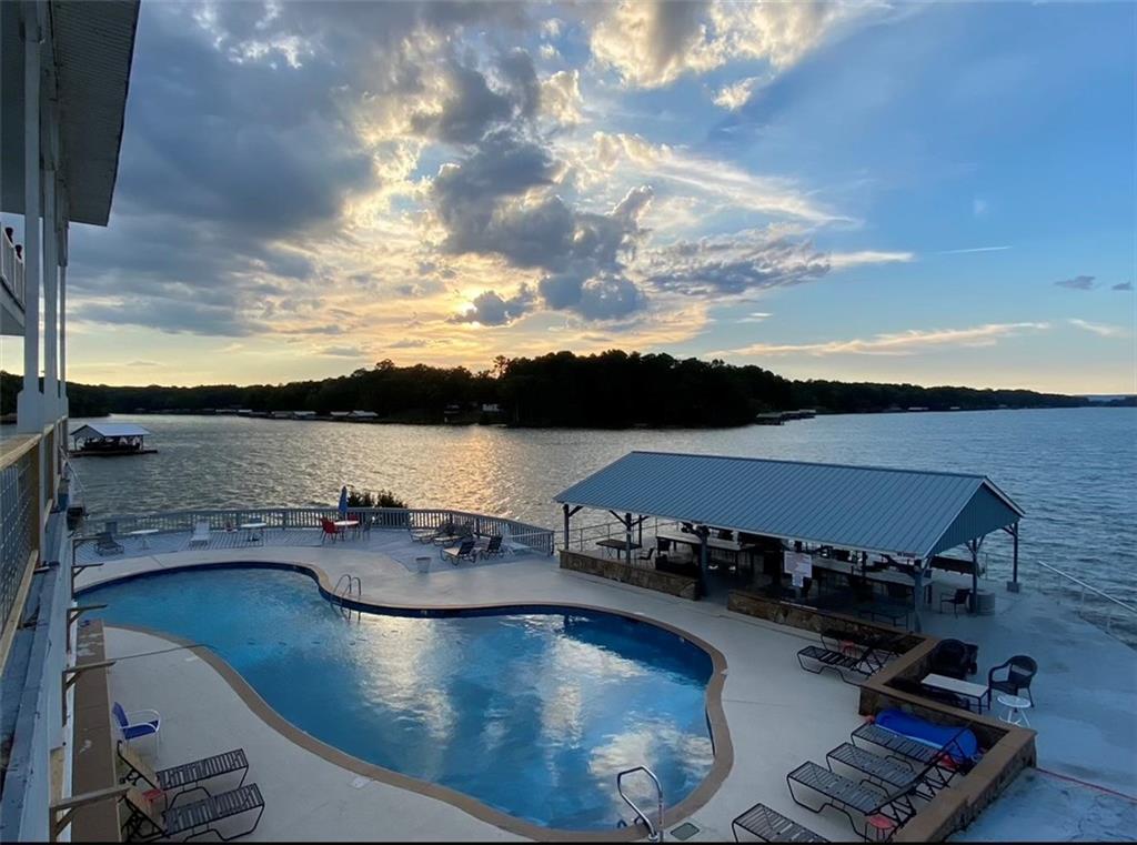 600 County Road 531, Unit 206 Centre, AL 35960 - Photo 2 of 36 a view of a swimming pool and lounge chair