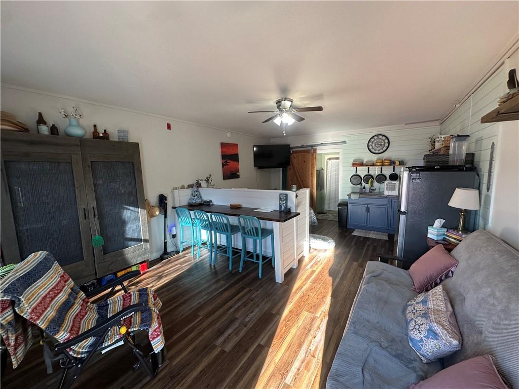 600 County Road 531, Unit 206 Centre, AL 35960 - Photo 25 of 36 a living room with furniture a flat screen tv and a table