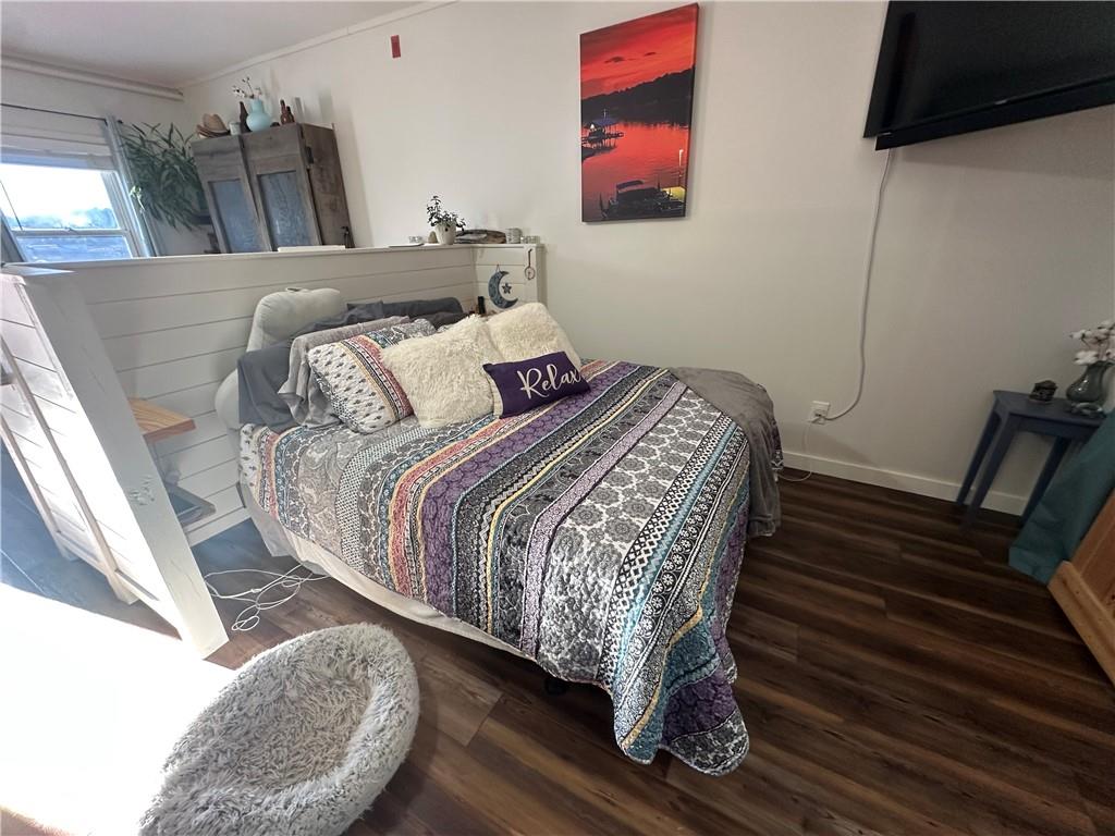 600 County Road 531, Unit 206 Centre, AL 35960 - Photo 31 of 36 a bedroom with a bed and a flat screen tv