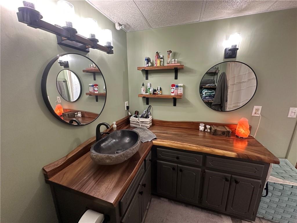 600 County Road 531, Unit 206 Centre, AL 35960 - Photo 32 of 36 a bathroom with a sink and a mirror
