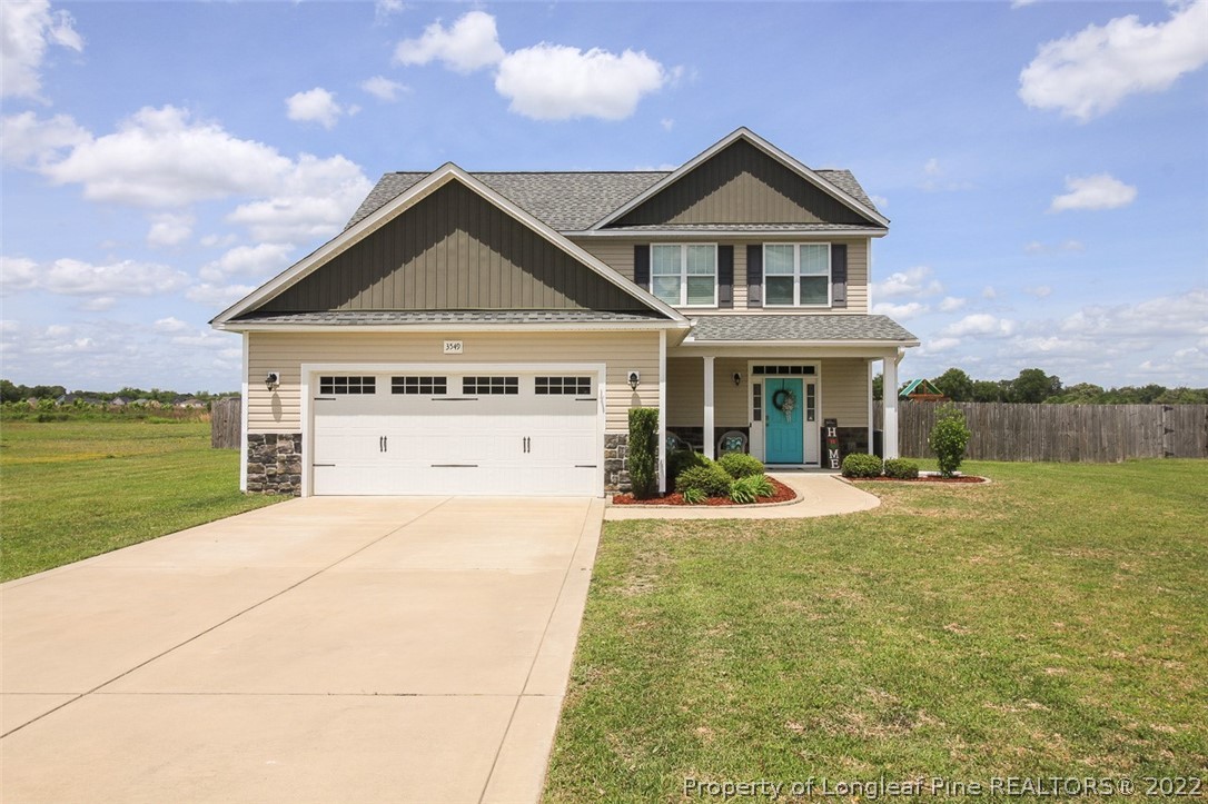 3549 Thrower Road Hope Mills, NC 28348 - Photo 1 of 38 a front view of a house with a yard