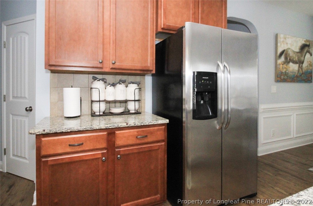 3549 Thrower Road Hope Mills, NC 28348 - Photo 11 of 38 a kitchen with stainless steel appliances granite countertop a refrigerator and a stove