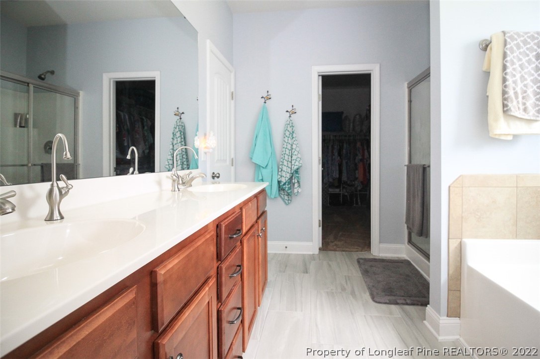 3549 Thrower Road Hope Mills, NC 28348 - Photo 18 of 38 a bathroom with a sink and a mirror