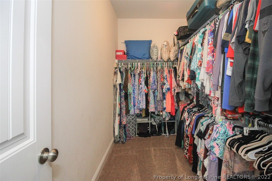 3549 Thrower Road Hope Mills, NC 28348 - Photo 22 of 38 a view of walk in closet with clothes