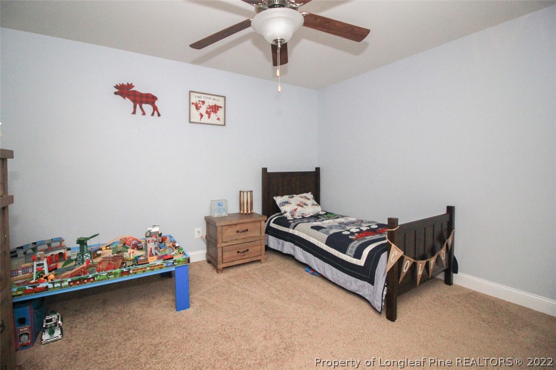 3549 Thrower Road Hope Mills, NC 28348 - Photo 27 of 38 a bed room with a bed and a couch