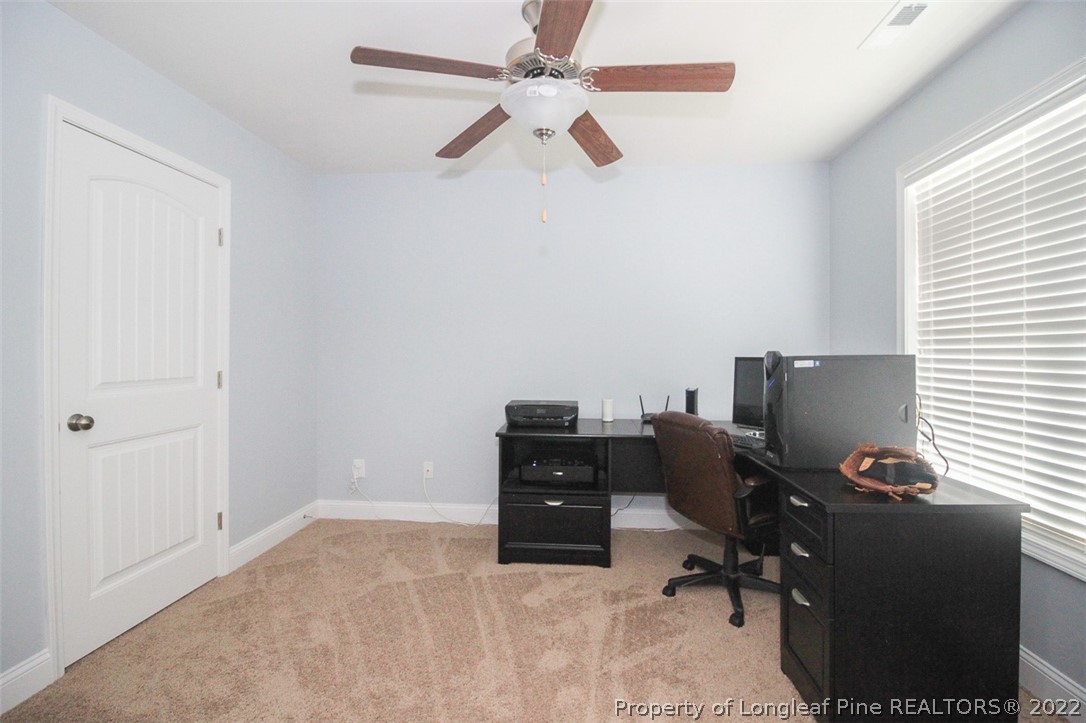 3549 Thrower Road Hope Mills, NC 28348 - Photo 29 of 38 a view of a workspace with furniture and a window