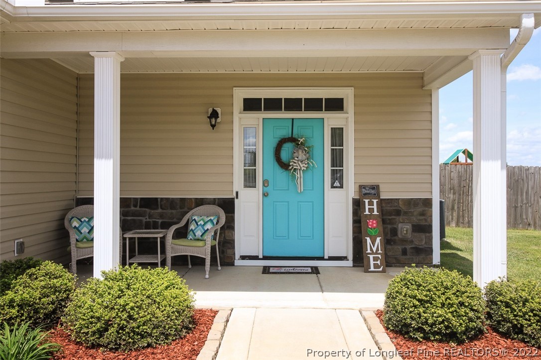3549 Thrower Road Hope Mills, NC 28348 - Photo 3 of 38 a front view of a house with a garden